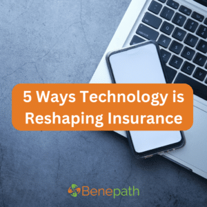 5 Ways Technology is Reshaping Insurance text overlaying image of a computer and a cellphone on a table