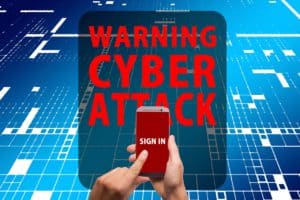 a hand holding a cell phone with the words sign in on it and above the cell phone are the words "warning cyber attack" in large letters