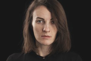 caucasian woman with a straight face