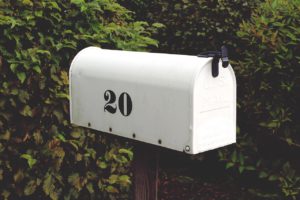 white mailbox with the number 20 on it in black