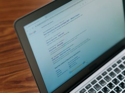 Laptop displaying search engine results, highlighting SEO optimization for marketing agencies.
