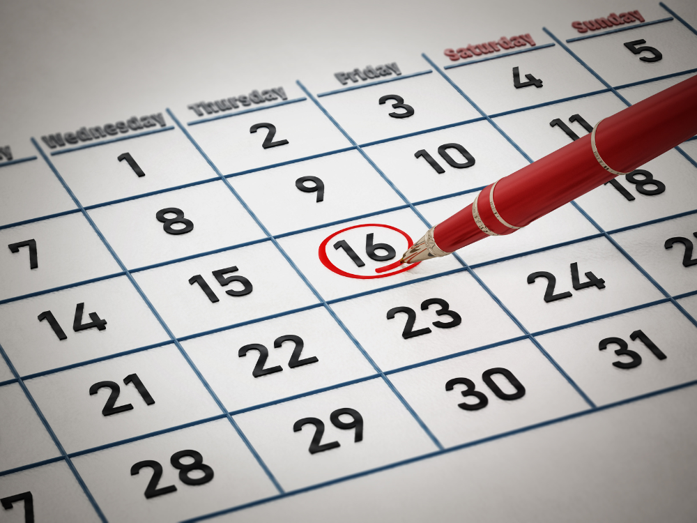 A close-up of a calendar with a red pen circling the 16th, symbolizing an important scheduled date.